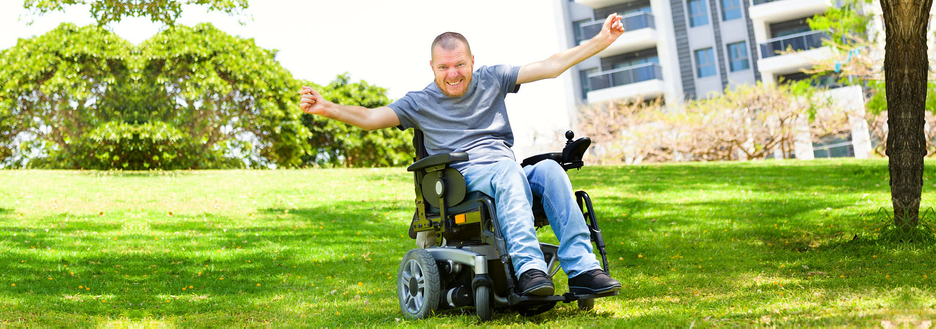 a happy disabled man on a wheelchair